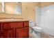 Bathroom showcasing wood cabinet vanity with faucet and a shower tub combination at 5209 Twin Bridge Blvd, Indianapolis, IN 46239