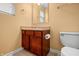 Cozy bathroom featuring stylish fixtures, a vanity with sink, and toilet at 5209 Twin Bridge Blvd, Indianapolis, IN 46239