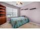 Bedroom featuring a bright window, carpet and a ceiling fan at 5209 Twin Bridge Blvd, Indianapolis, IN 46239