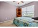Bedroom featuring a bright window, carpet, ceiling fan and a corner bookshelf at 5209 Twin Bridge Blvd, Indianapolis, IN 46239