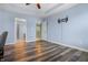 Bedroom featuring hard wood floors, blue walls, and tv mounting hardware at 5209 Twin Bridge Blvd, Indianapolis, IN 46239