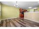 Open concept dining area featuring wood floors, access to kitchen with dark wood cabinets, and lots of natural light at 5209 Twin Bridge Blvd, Indianapolis, IN 46239