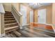 Inviting entryway with updated floors and a staircase leading to the upper level at 5209 Twin Bridge Blvd, Indianapolis, IN 46239