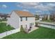 Aerial view of home featuring backyard, patio, green lawn, and white fence at 5209 Twin Bridge Blvd, Indianapolis, IN 46239