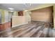 Open concept living room featuring wood flooring and lots of natural light. Perfect for entertaining or relaxing at 5209 Twin Bridge Blvd, Indianapolis, IN 46239