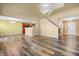 Open-concept living space with modern hardwood flooring and ample natural light at 5209 Twin Bridge Blvd, Indianapolis, IN 46239