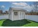 View of storage shed with siding, double doors, and a small window at 5209 Twin Bridge Blvd, Indianapolis, IN 46239
