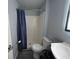 The bathroom features a shower with tub and a toilet with shelving for organized storage at 5240 Regency Dr, Columbus, IN 47203