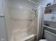 Bathroom with a walk-in shower and a decorative shower curtain, along with a built-in shelving unit at 5240 Regency Dr, Columbus, IN 47203
