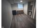 The bedroom features wood-look flooring, natural light from a window, and ample storage at 5240 Regency Dr, Columbus, IN 47203