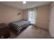 Bedroom featuring a bed, neutral walls, carpet, and natural light coming in from the window at 5240 Regency Dr, Columbus, IN 47203