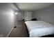 This bedroom boasts neutral walls and carpet, a large bed, and a built-in closet for optimal storage at 5240 Regency Dr, Columbus, IN 47203