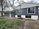 The exterior of this house features a wooden porch and a door at 5240 Regency Dr, Columbus, IN 47203