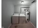 Efficient laundry area featuring a washer, dryer, and water heater, ideal for convenient home maintenance at 5240 Regency Dr, Columbus, IN 47203