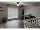 Comfortable living room featuring a ceiling fan, hardwood floors, and neutral wall paint at 5240 Regency Dr, Columbus, IN 47203