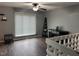 Cozy living room with hardwood floors, a ceiling fan, and ample natural light at 5240 Regency Dr, Columbus, IN 47203