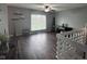 Inviting living room with hardwood floors, shelving, and a neutral color scheme at 5240 Regency Dr, Columbus, IN 47203