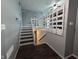 Stairway with painted gray walls, white accents, hardwood floors, and a view of the basement at 5240 Regency Dr, Columbus, IN 47203