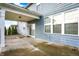 The covered patio offers views of the backyard and mature trees at 5247 Crowley Pkwy, Whitestown, IN 46075