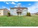 The home has a large green lawn with a backyard and patio at 5247 Crowley Pkwy, Whitestown, IN 46075