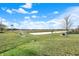 Expansive backyard features lush green grass, a scenic pond, and community views at 5247 Crowley Pkwy, Whitestown, IN 46075