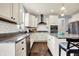 Lovely kitchen with white cabinets, stainless steel appliances, granite countertops, and a breakfast bar at 5247 Crowley Pkwy, Whitestown, IN 46075