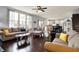Open-concept living room with wood floors, seamless flow to the kitchen, and comfortable seating for Gathering and guests at 5247 Crowley Pkwy, Whitestown, IN 46075