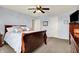 Serene main bedroom featuring a sleigh bed, ceiling fan, and soft carpet for a comfortable retreat at 5247 Crowley Pkwy, Whitestown, IN 46075
