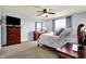 A cozy main bedroom features a sleigh bed, neutral decor, and plenty of dresser space for relaxing at 5247 Crowley Pkwy, Whitestown, IN 46075