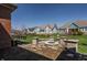 Attractive backyard with a stone firepit, seating area, lush green lawn and beautiful community homes at 528 Dylan Dr, Carmel, IN 46032