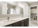 Bathroom showcasing a double vanity with a large mirror, great countertop space, and wood cabinets at 528 Dylan Dr, Carmel, IN 46032