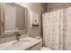 Cozy bathroom featuring a white vanity, patterned shower curtain, and stylish mirror at 528 Dylan Dr, Carmel, IN 46032
