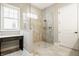 Bathroom featuring a glass-enclosed shower, a built-in vanity, natural light, and ceramic tile flooring at 528 Dylan Dr, Carmel, IN 46032