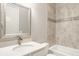 Bathroom showcasing a vanity with a mirror, bathtub with tiled surround, ceramic tile flooring, and toilet at 528 Dylan Dr, Carmel, IN 46032