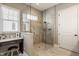 Bright bathroom featuring tiled walk-in shower, vanity area and sink, and neutral decor at 528 Dylan Dr, Carmel, IN 46032