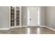 Bright entryway showcasing a white front door with sidelights and classic French doors at 528 Dylan Dr, Carmel, IN 46032