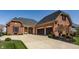 Charming brick home with a spacious driveway and a two-car garage at 528 Dylan Dr, Carmel, IN 46032