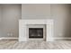 Close up of the fireplace with white mantle and gray tile at 528 Dylan Dr, Carmel, IN 46032