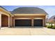 Lovely two-car garage with a spacious driveway and a well-manicured lawn at 528 Dylan Dr, Carmel, IN 46032