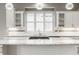 Kitchen featuring white cabinetry, granite countertops, stainless appliances, and pendant lighting at 528 Dylan Dr, Carmel, IN 46032