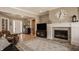Comfortable living room with a fireplace and a large television at 528 Dylan Dr, Carmel, IN 46032