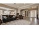 Inviting living room with a comfortable leather sofa, cozy armchair, and a stylish rug, showcasing an open floor plan at 528 Dylan Dr, Carmel, IN 46032