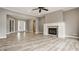 Spacious living room with fireplace, French doors, and a bright entryway at 528 Dylan Dr, Carmel, IN 46032