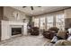 Bright living room with a fireplace and a large window and hardwood flooring at 528 Dylan Dr, Carmel, IN 46032