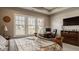 Bright main bedroom featuring large windows, a decorative bed, and a cozy workspace with built-in desk at 528 Dylan Dr, Carmel, IN 46032