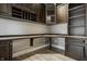 Office area with custom wood cabinetry, built-in desk, and modern finishes at 528 Dylan Dr, Carmel, IN 46032