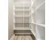 Walk-in pantry featuring built-in shelving providing ample storage at 528 Dylan Dr, Carmel, IN 46032