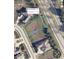 Aerial view of a 0.23 Ac lot in Horizon West Major Sub surrounded by mature trees and neighboring houses at 6100 Horizon Dr, Columbus, IN 47201