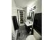 Modern bathroom with a vanity, sleek black fixtures, and ample storage space at 6225 Roberts Creek Ln, Indianapolis, IN 46221