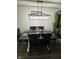 Dining room with modern chandelier, farmhouse table, and stylish black chairs for gatherings at 6225 Roberts Creek Ln, Indianapolis, IN 46221